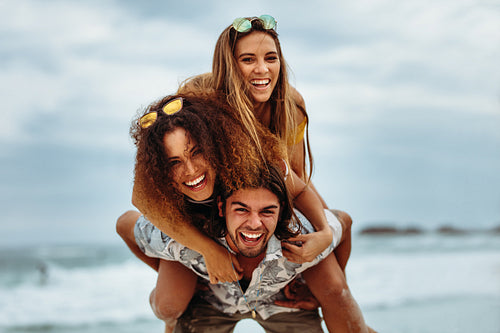 Multi-ethnic friends enjoying summer holidays on beach