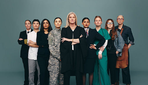 Diverse female workers standing together in a studio