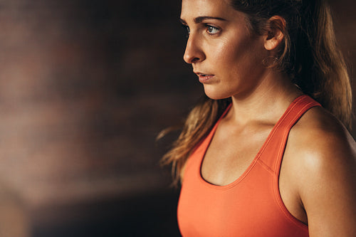 Female taking break after workout at gym
