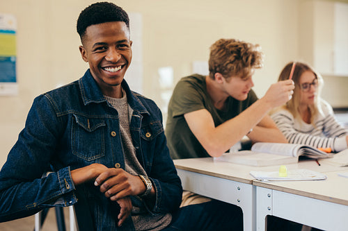 African student with classmates in classroom