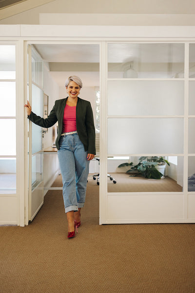 Successful businesswoman smiling happily in an office