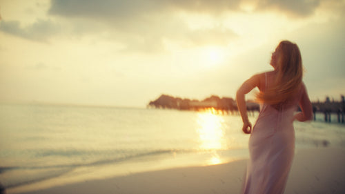 Dreamlike romantic couple moment on beach at tropical sunset