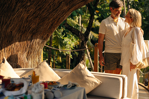 Happy couple enjoying a luxury treehouse resort getaway in a tropical paradise