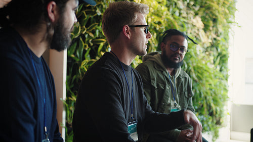 Young business men having a discussion in a workshop