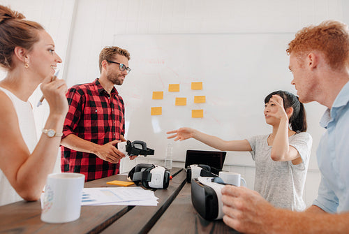 Business people discussing virtual reality technology