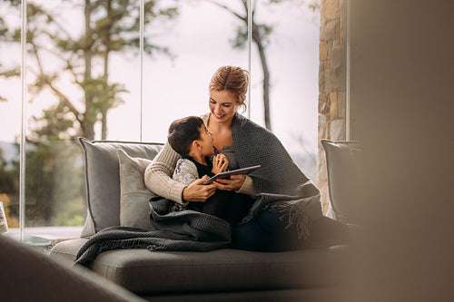 Little boy having fun with mother at home