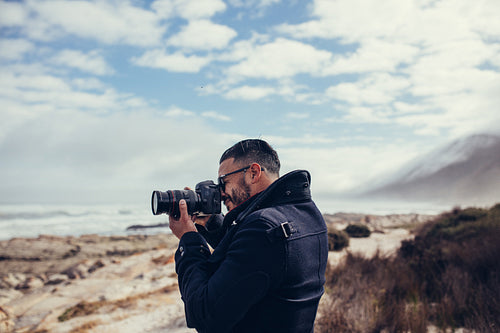 Model taking a photo outdoors