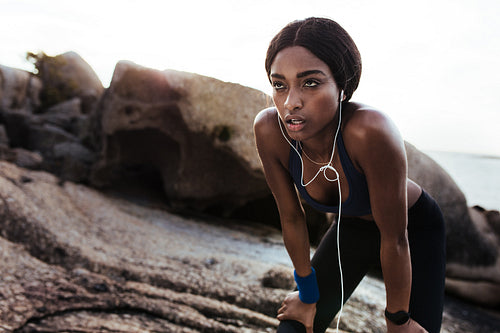 Tired woman resting after running