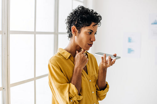 Woman having a business phone call in an office
