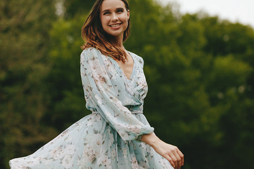 Beautiful woman dancing in the park