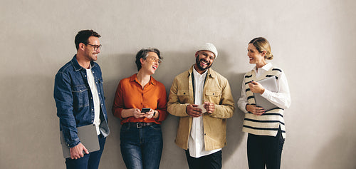 Group of happy businesspeople smiling while waiting in line