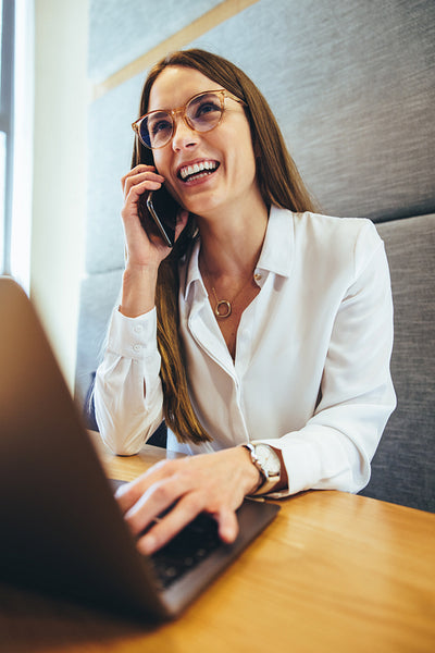 Smiling businesswoman taking a phone call