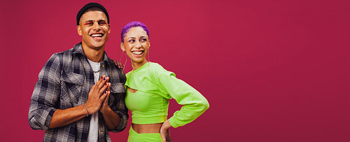 Hipster friends standing together in a studio