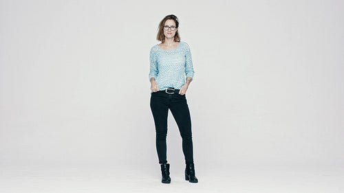 Stylish woman standing  with hands in pocket