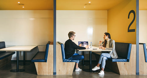 Professional team of business people discussing software development in a modern coworking office