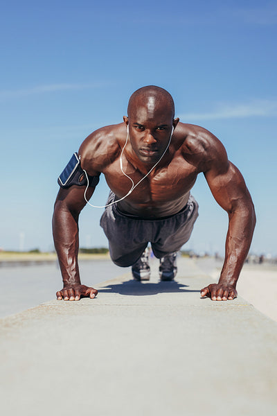 Fit young guy doing push-ups