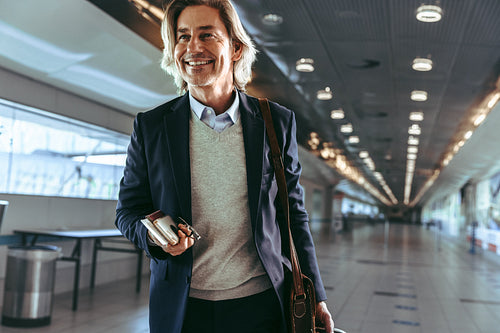 Male traveler moving towards flight boarding gate