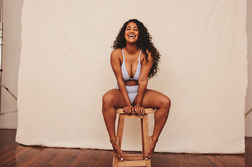 Happy young woman feeling comfortable in her natural body