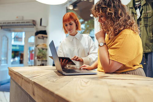 Fashion boutique owners running their business online