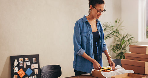 Drop shipping business owner packing face masks order