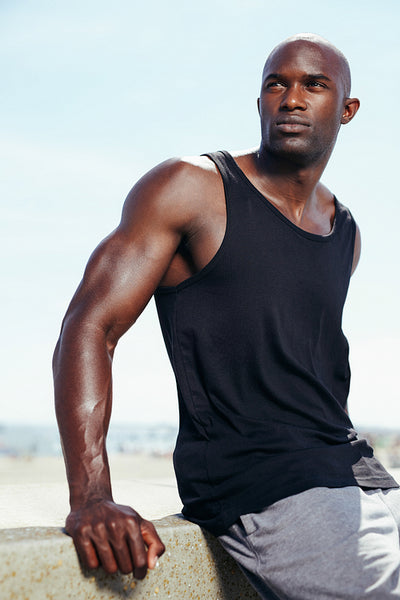 Handsome young african male model looking away.