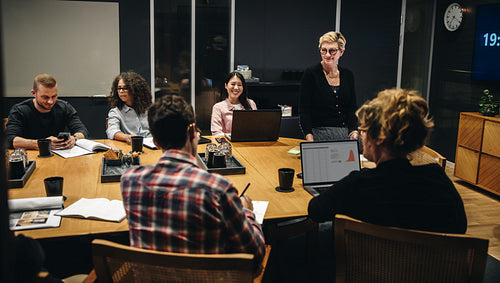 Woman taking lead in boardroom meeting