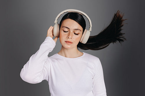 Woman listening to music with her eyes closed