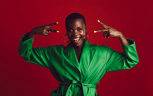 Excited woman with colorful makeup