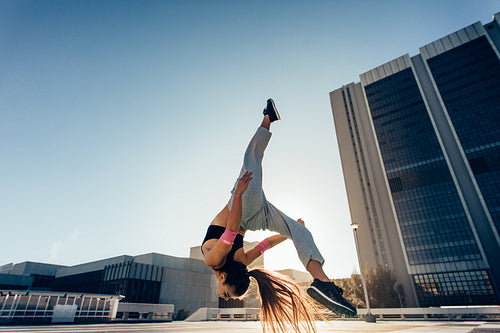 Urban woman performing a flashkick