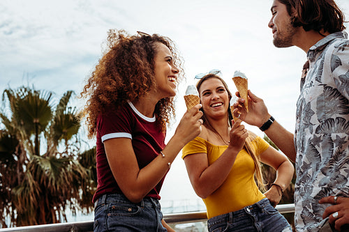 Diverse group of friends eating ice-cream