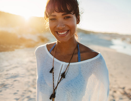 Stylish young woman on the beach