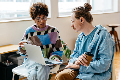 Freelancers collaborating in bright co-working space