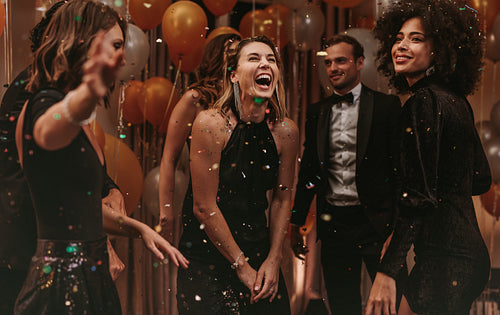 Group of socialites enjoying dancing at new years party