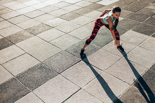 Woman doing warm up stretches