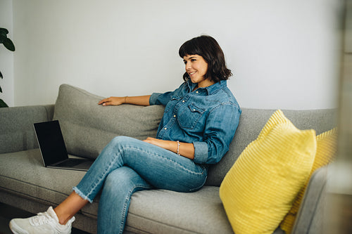 Confident woman sitting in office lobby