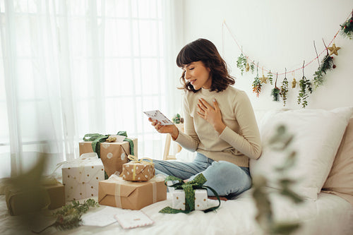 Woman happy to see a christmas letter 