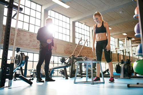 Woman exercising with a personal trainer