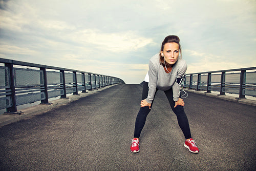 Focused Female Runner Resting