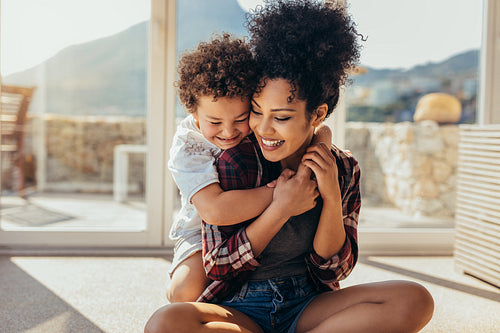 Boy playing with his mother at home