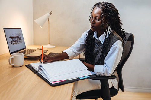 Young architect working on design projects in an office setting