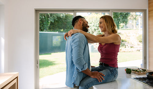 Couple sharing a romantic moment in kitchen