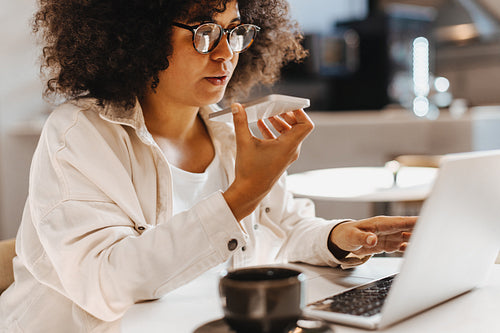 Business woman making a phone call to her clients during remote work