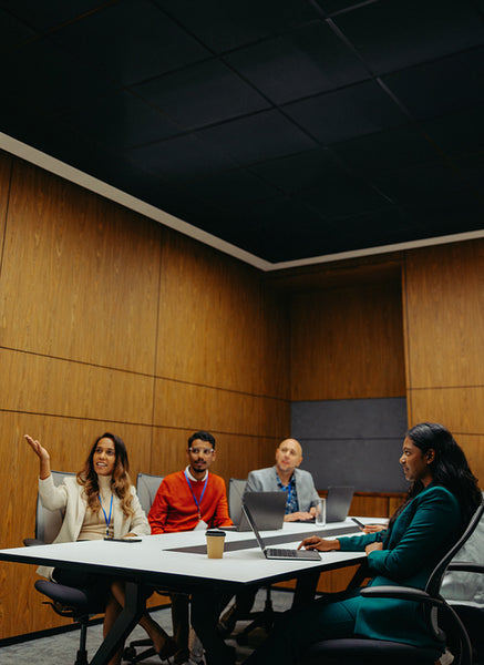 Diverse team engaged in collaborative business meeting discussion