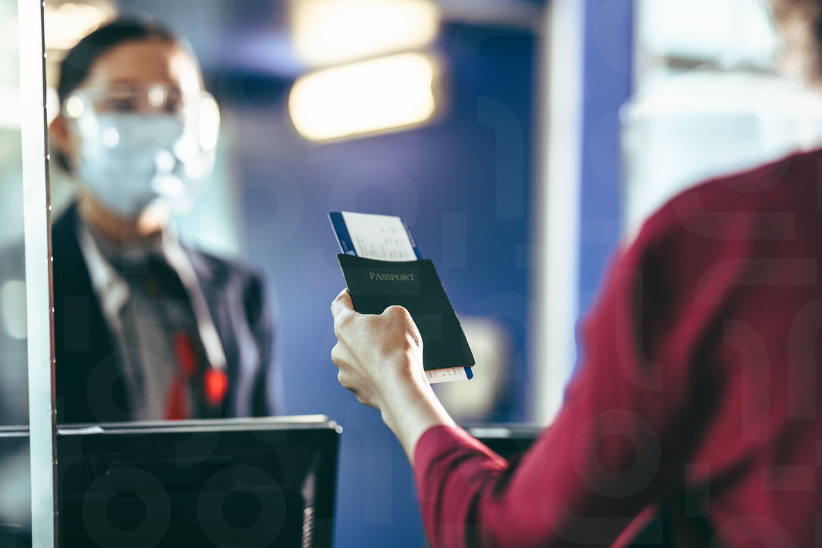 Woman doing check-in at the airport – Jacob Lund Photography Store ...