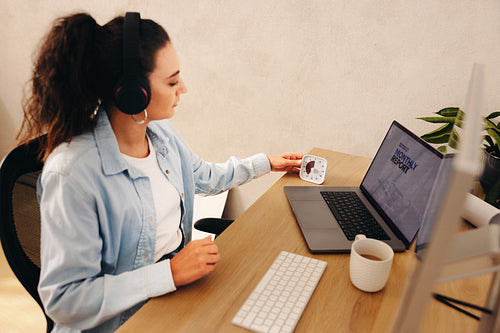 Female professional working with timer to enhance productivity at the workspace