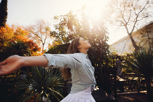 Woman at plant nursery enjoying fresh air