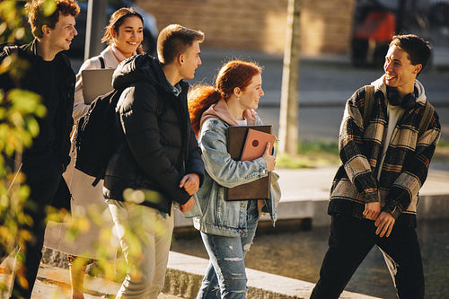 Young people walking outside after class