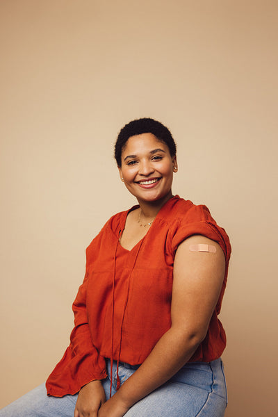 Woman looking happy after getting inoculated