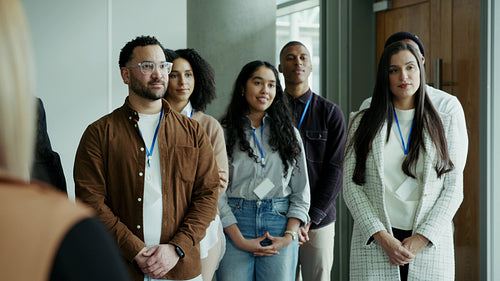 Happy young professionals applaud presentation