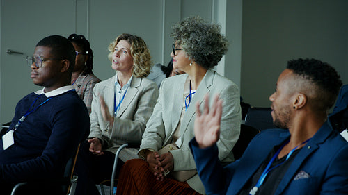 Attendees listening attentively at a corporate conference event
